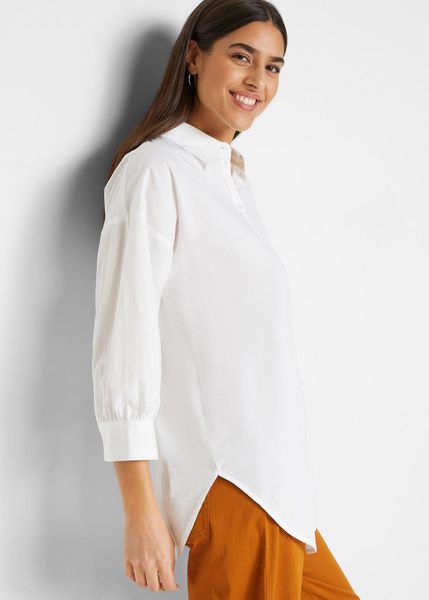 Koszula oversize z bawełny, rękawy 3/4. Białe koszule bonprix, bez wzorów, z bawełny, bez kołnierzyka, bez ramiączek. Za 82.99 zł.
