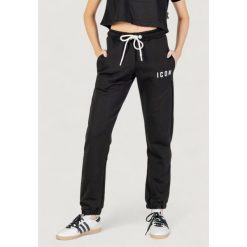Spodnie Kobieta ICON. Czarne spodnie dresowe ICON, bez wzorów. W wyprzedaży za 289.35 zł.